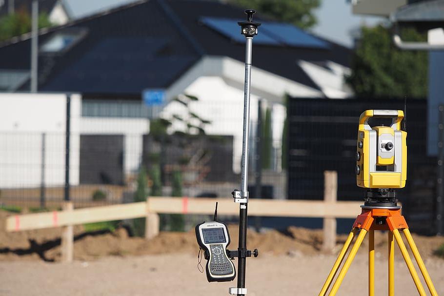 surveying tool under an umbrella.