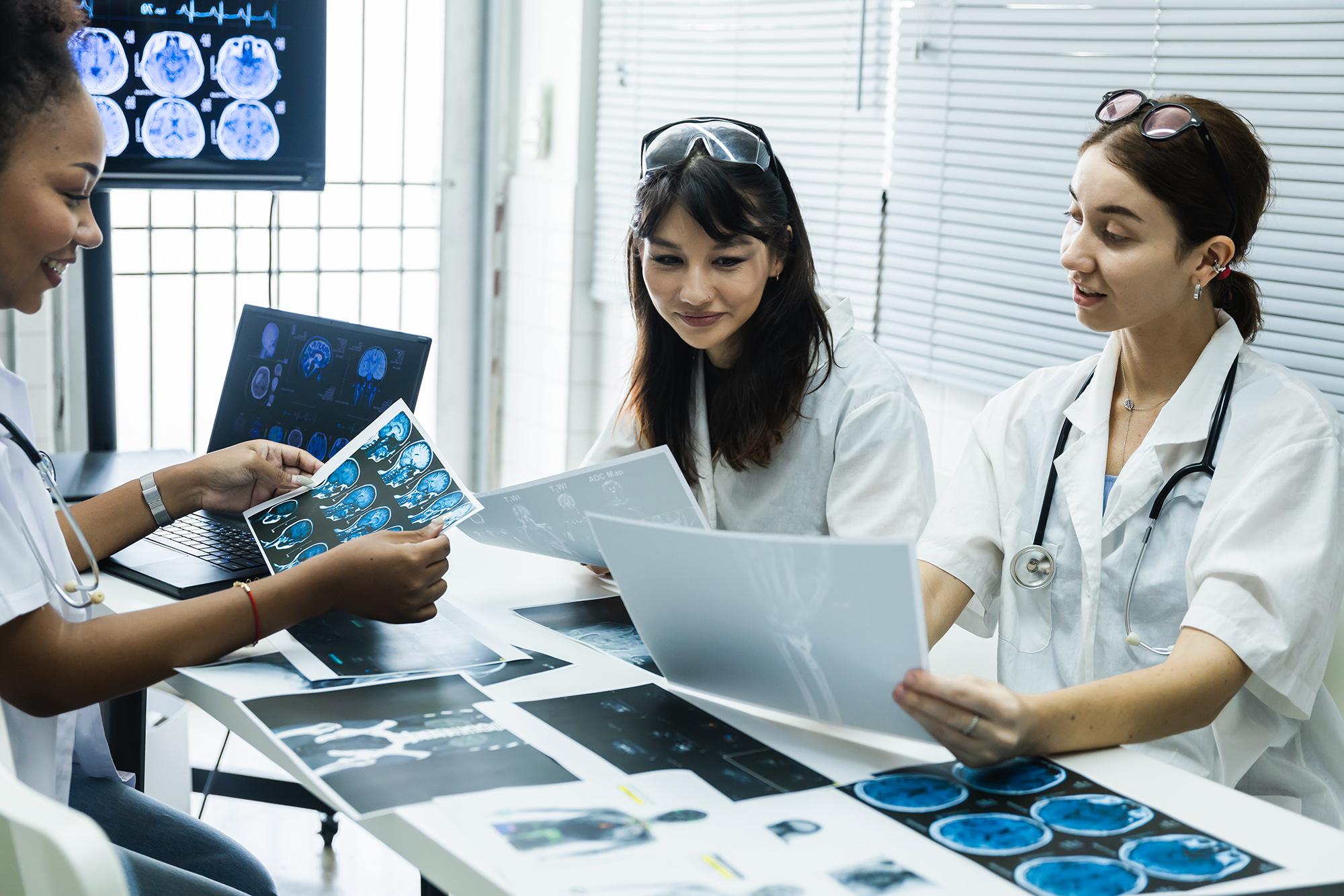 A group of doctors going over some x-ray scans