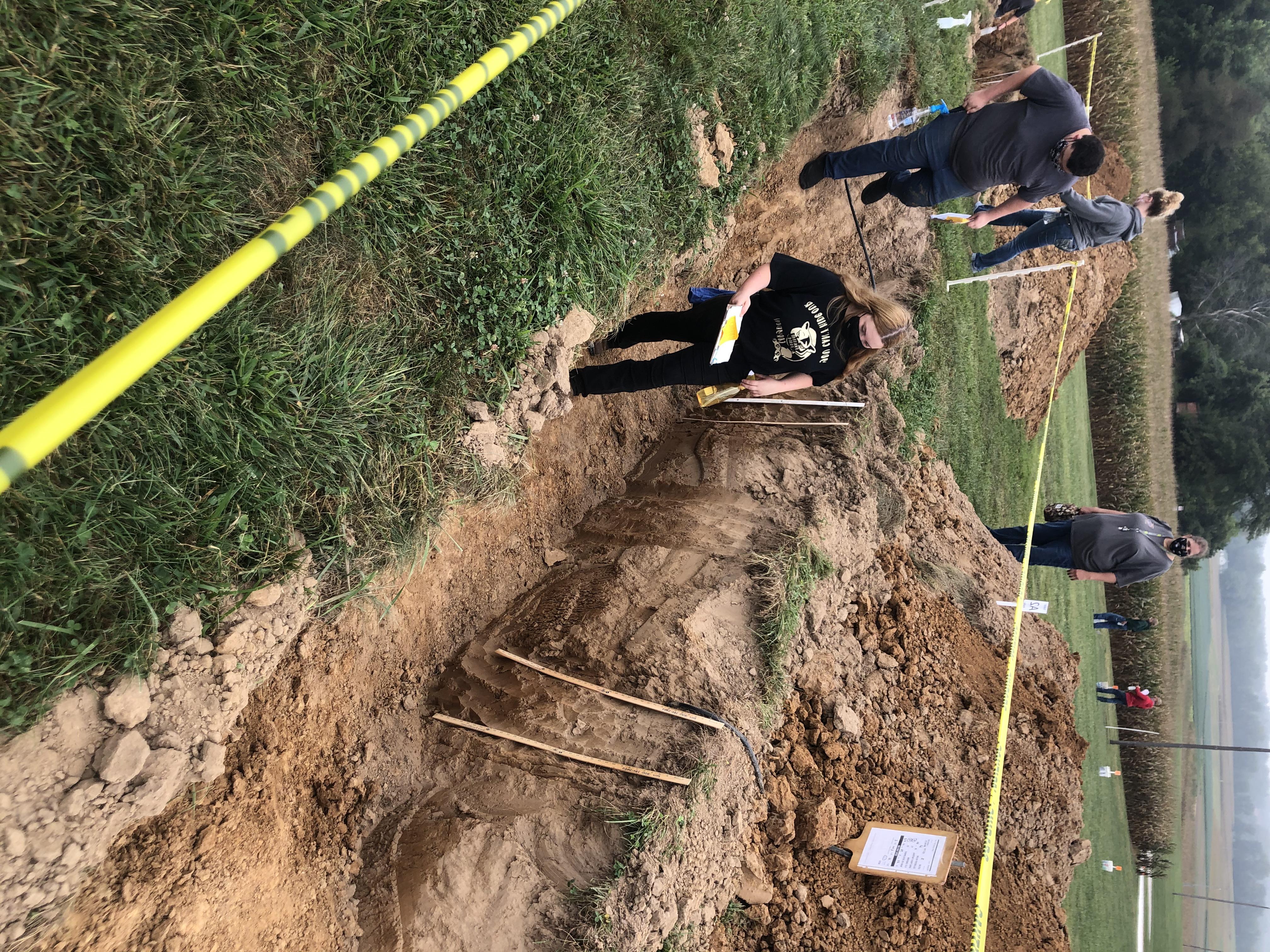 Students investigating a dig site