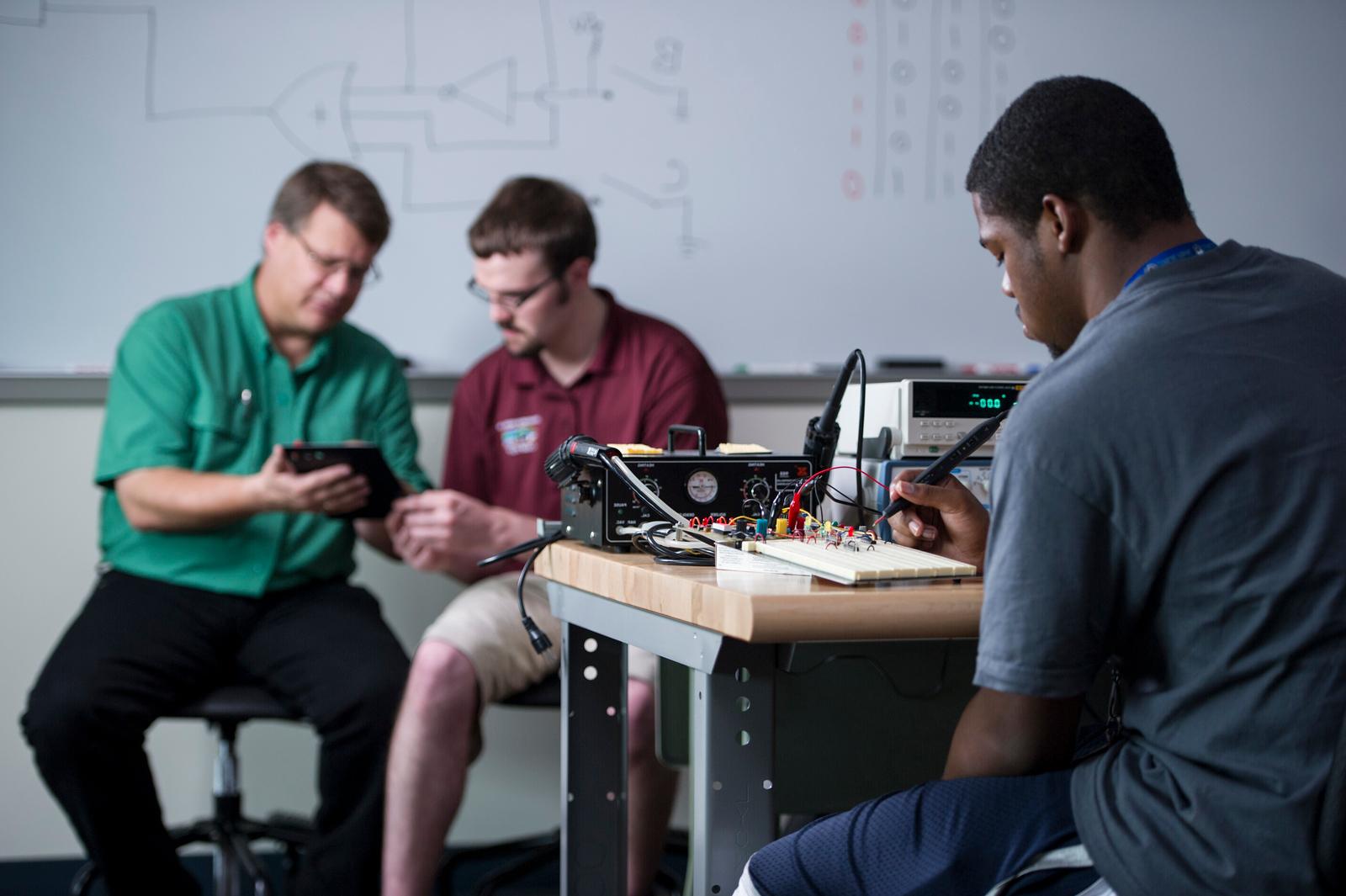 Tech Ed student using machinery.